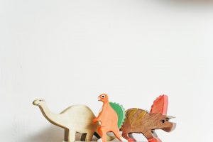 wooden-dinosaur-in-white-backgroud-3661194-300x200.jpg