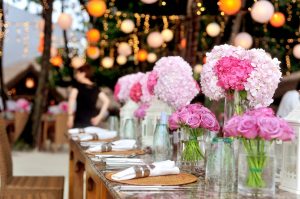 table-with-plates-and-flowers-filed-neatly-selective-focus-169190-300x199.jpg
