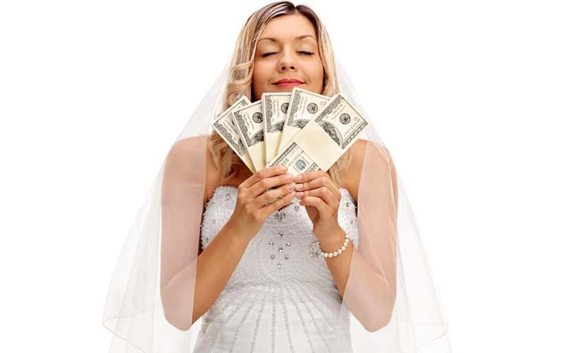 10-bride-smelling-a-couple-of-stacks-of-money.jpg
