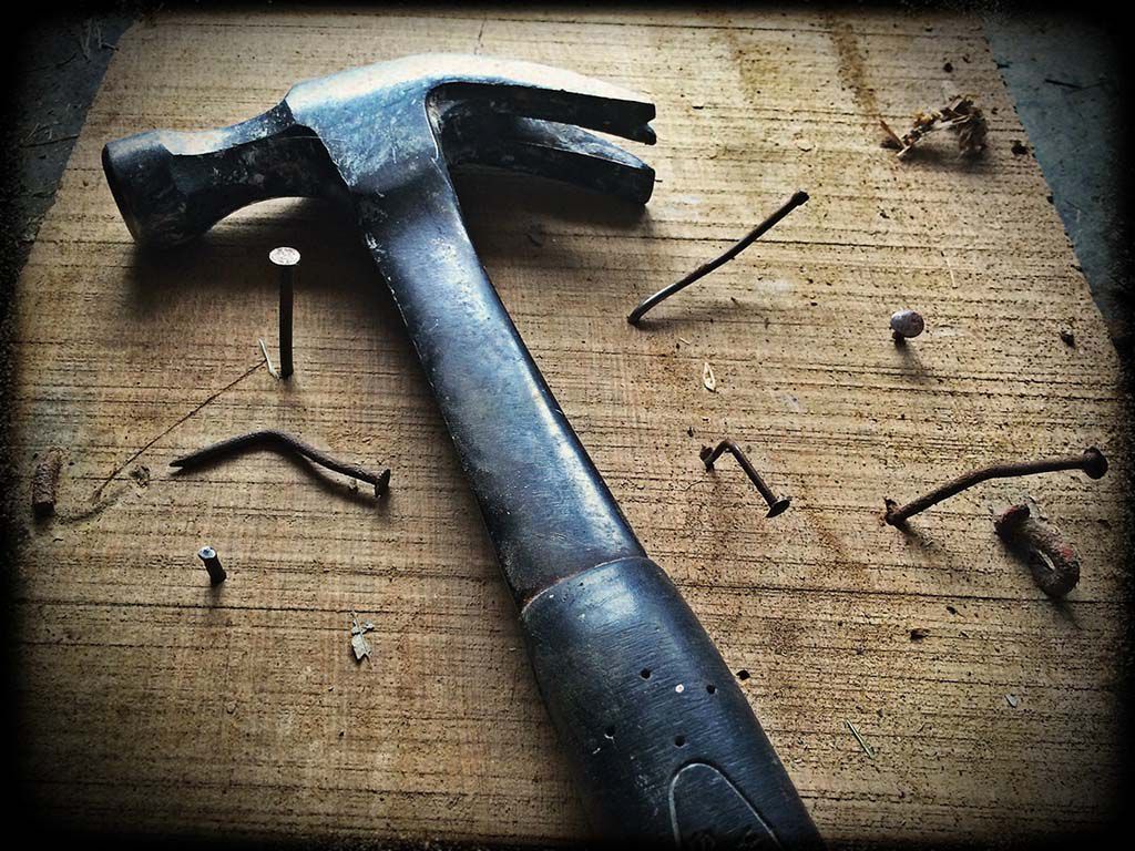 resizeblack-claw-hammer-on-brown-wooden-plank-209235.jpg.optimal.jpg